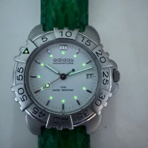 Adidas Adventure Silver Dial with Green Strap excellent condition.NewBattery.